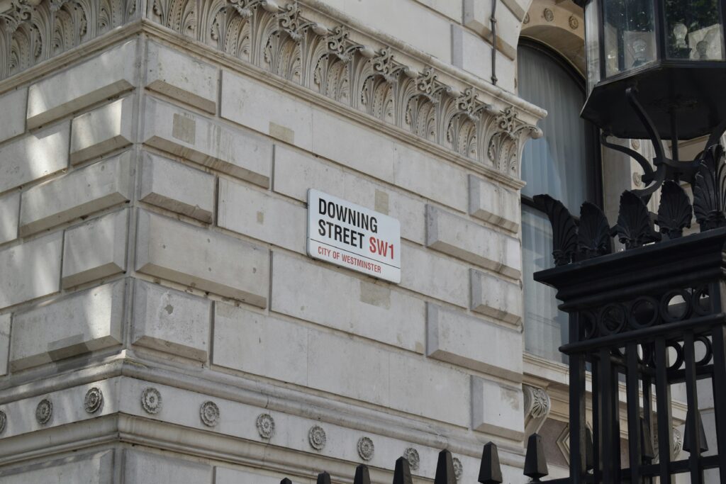 Image of downing st. street sign on building